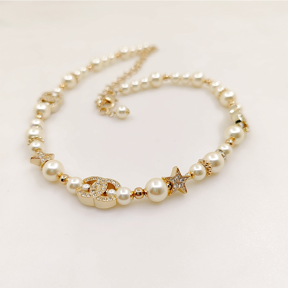 Chanel Pearl Necklace with Star and CC Charms - Timeless Elegance