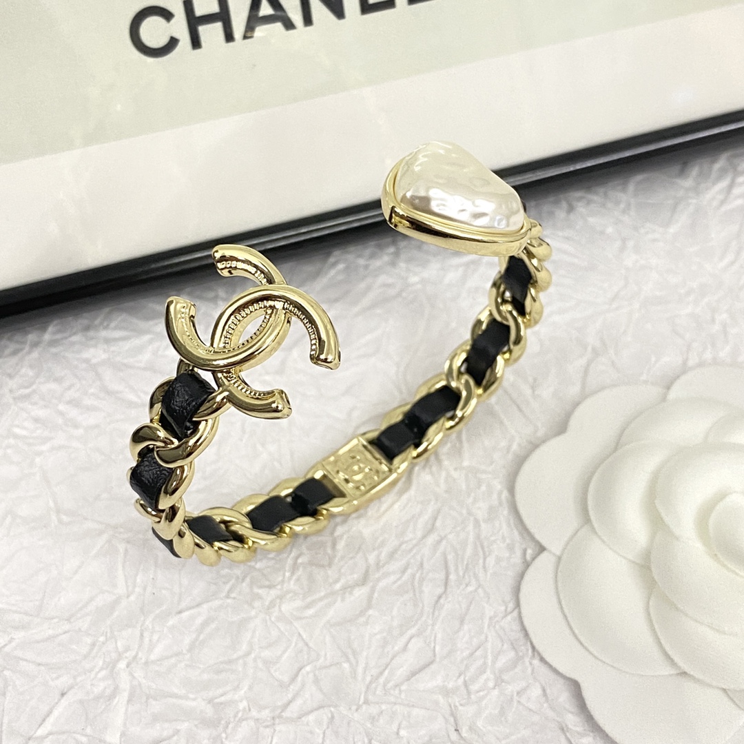 Chanel CC Logo Cuff Bracelet - Gold and Black Elegance