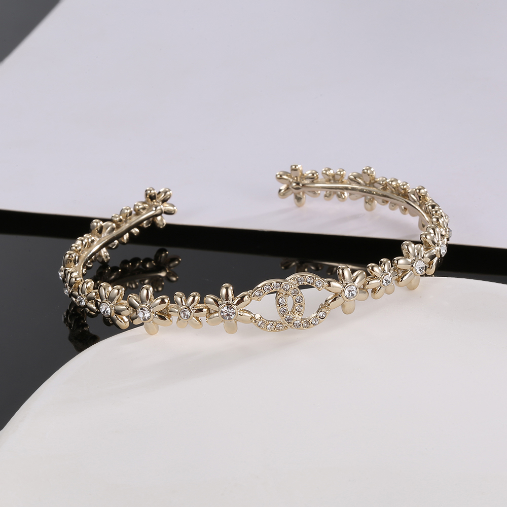 Chanel-Inspired Floral Cuff Bracelet - Gold Tone Elegance