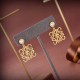 Loewe's Golden Elegance: Pearl and Monogram Earrings