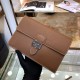 Hermès Tan Leather Clutch | Chic Buckle Closure | 